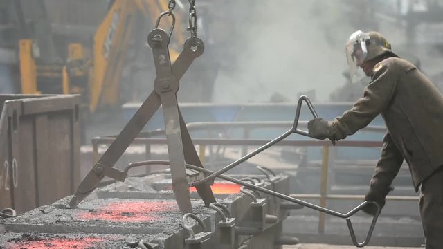 Workers on ferroalloy factory
