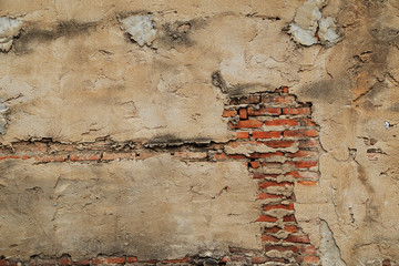 The old cracked wall of the abandoned ruins.