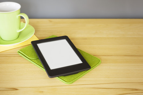 ebook reader on a wooden table