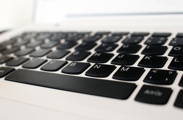 White office laptop keyboard with black buttons