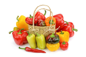 Set bell peppers in a basket isolated on a white background