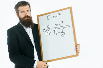 bearded man with einstein formula and newtons law
