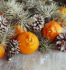Christmas balls with fir branches and glasses of champagne