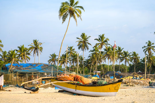 Indian fishing boat on the shore of Goa beach