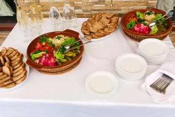 Plates with pickled cucumbers and tomatoes