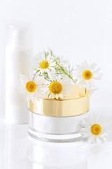 chamomile and jars of cream on the white background  - 116392011