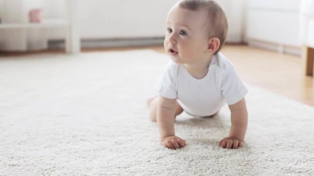 happy little baby crawling in living room at home 8