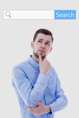 internet search concept - portrait of young man thinking about s