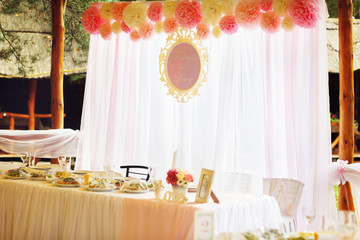 Wedding table stands on the open air in a restaurant