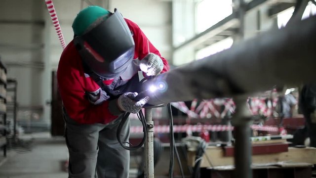 The nuclear power plant. Manual welding is carried out by the welder. HD