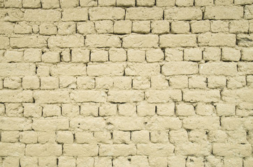 Old adobe wall closeup in
