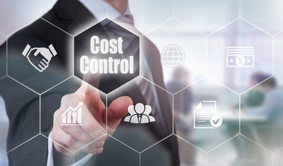 A businessman selecting a Cost Control Concept button on a hexagonal screen