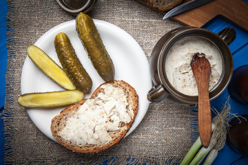 Slice of country bread with homemade lard and cucumber.