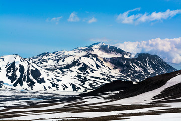 Peaks of mountains above the clouds, Russia, Kamchatka
