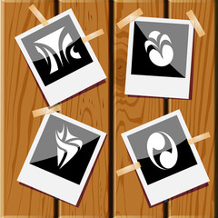 4 images of unique abstract forms. Photo frames on wooden desk.