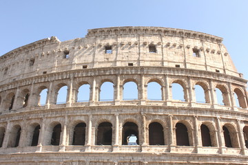 Fototapeta premium Great Colosseum in Rome, Italy, Europe. Roman Coliseum close-up with clear blue sky.