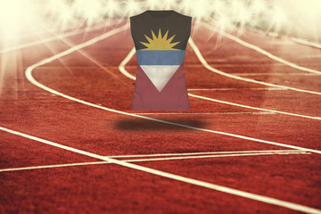 red running track with lines and Antiqua and Barbuda flag on shirt