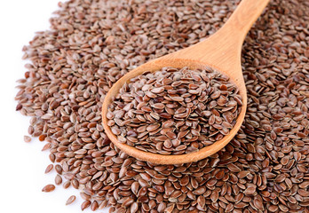 Flax seeds heap in wood spoon