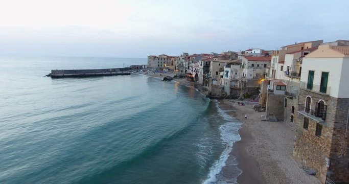Evening panorama of an old town from the sea