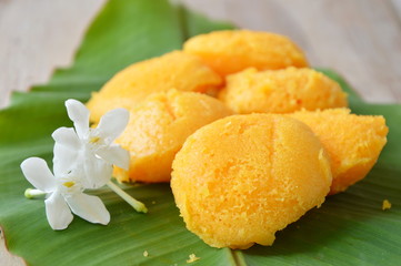 toddy palm cake Thai dessert and cape jasmine on banana leaf