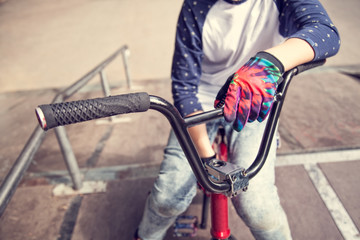 Obraz premium Young BMX rider boy sitting on a bicycle