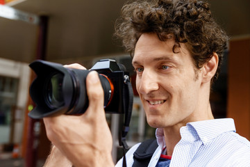 Male photographer taking picture