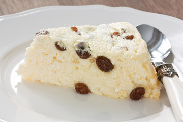 Cottage cheese souffle / Delicious slice cottage cheese souffle with raisins on white plate