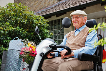Elderly Person on Electromobile © Ingo Bartussek
