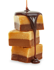 Chocolate flow on Fudge. Isolated on a white.