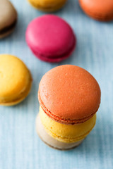 Colored macaroons on blue background

