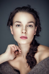 Beauty portrait of brunette with fur cape on shoulders