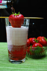 Fresh strawberry drink, radler fruit beer with white foam head