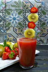 Fresh pressed strawberry and gold kiwi juice in a glass