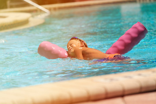 little boy enjoy swimming in the pool, active kids