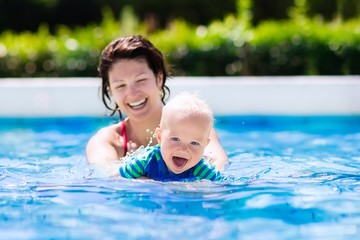 Fototapeta na wymiar Mother and baby in swimming pool
