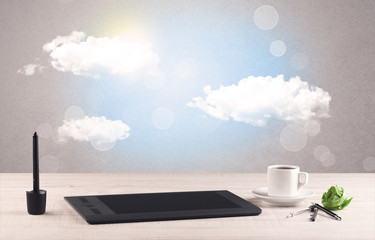 Bright sky with clouds and office desk