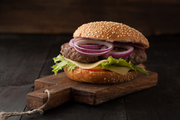 Hamburger with beef meat and fresh vegetables