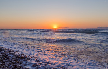 Fototapeta premium Expanse of the sea against the sunset sky. Beautiful seascape.
