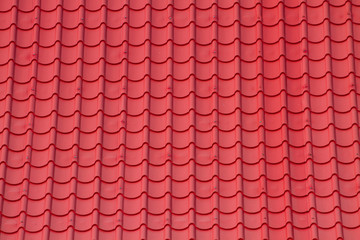 Red corrugated tile element of roof