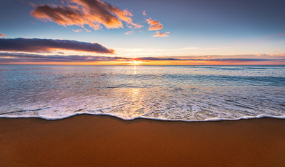 Colorful seaside beach sunrise.