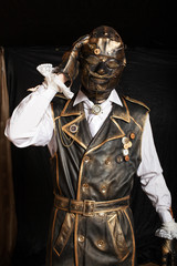 Man in a vintage shirt and a cyberpunk mask