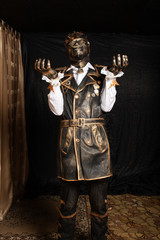 Fototapeta premium Man in a mask in a cyborg costume against black background