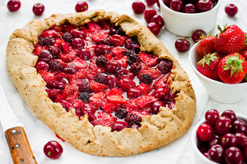 Rye dough galeta pie with fresh strawberry, cherry and blackberry