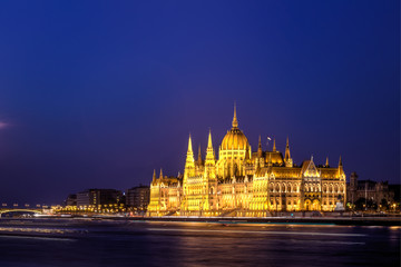 Fototapeta na wymiar The Hungarian Parliament Building close to Danube river at night.