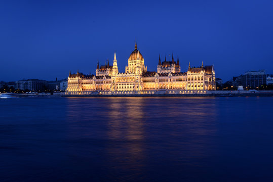 The Hungarian Parliament Building close to Danube river at night.