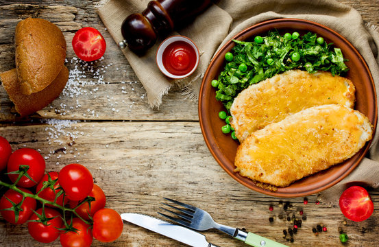 Delicious Dinner Chicken Schnitzel With Cheese Lettuce Salad