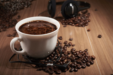 coffee and headphones on the table