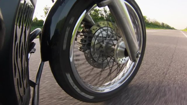 Motorcycle wheel goes forward. Close up