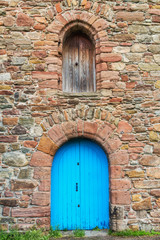 Fototapeta na wymiar Old wooden door in stone Scotish church