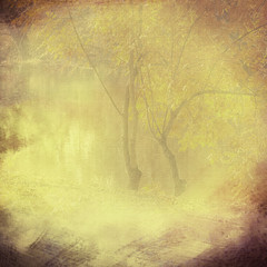 Vintage background vignette with a silhouette of trees on a clot